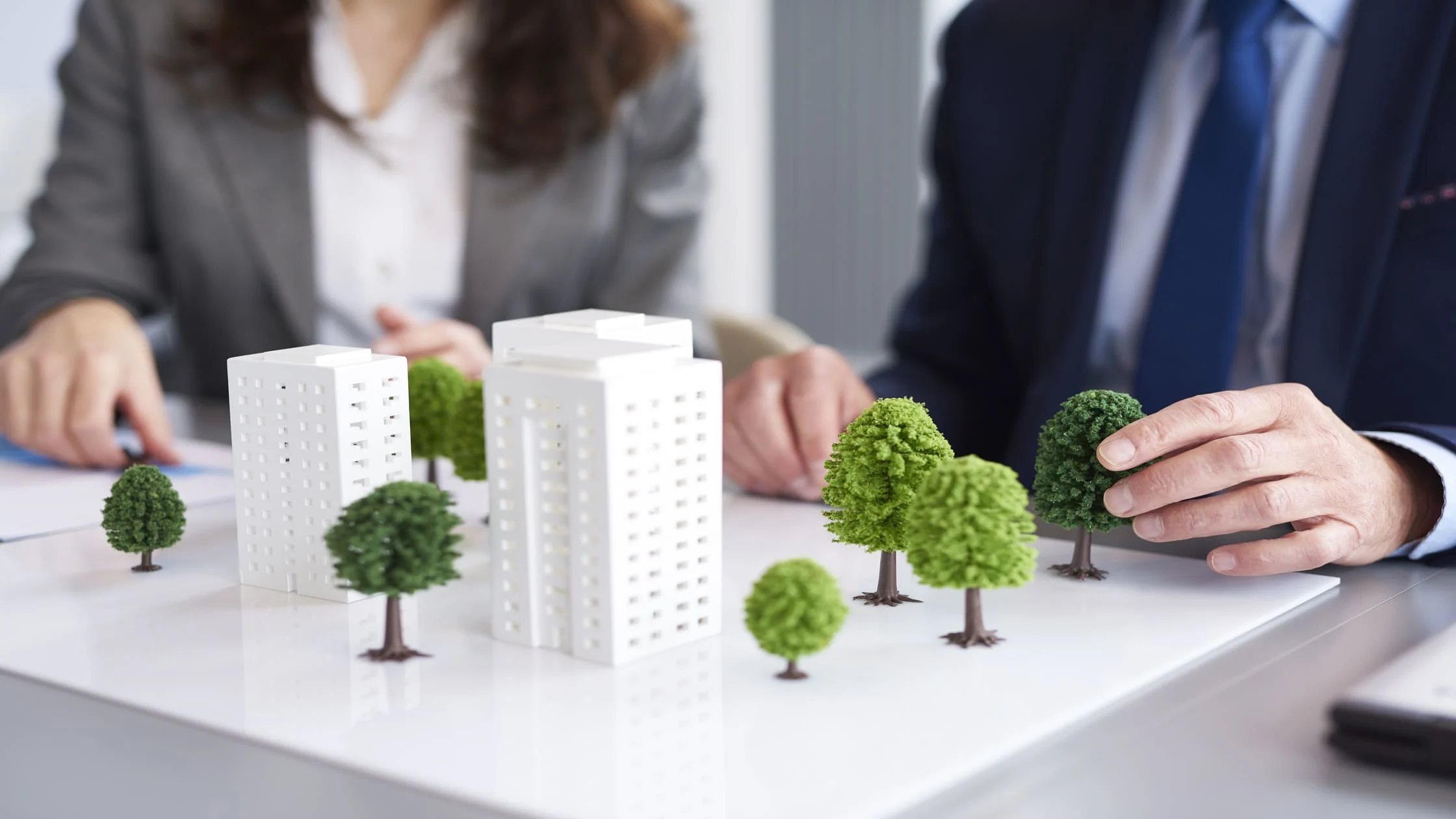 property-manager-checking-building-exterior-with-rental-property-inspection-checklist