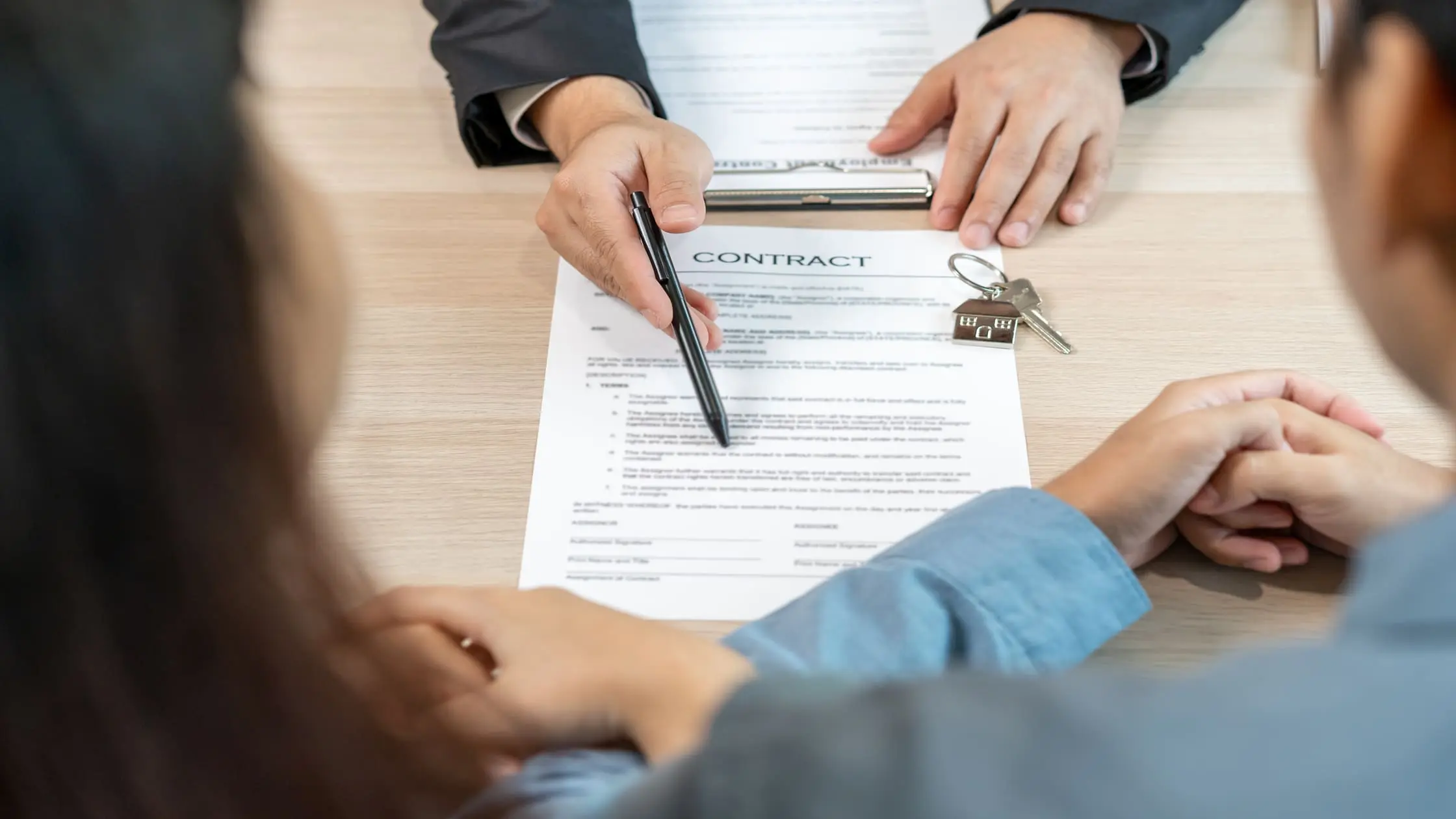 Tenant and landlord signing a lease buyout contract