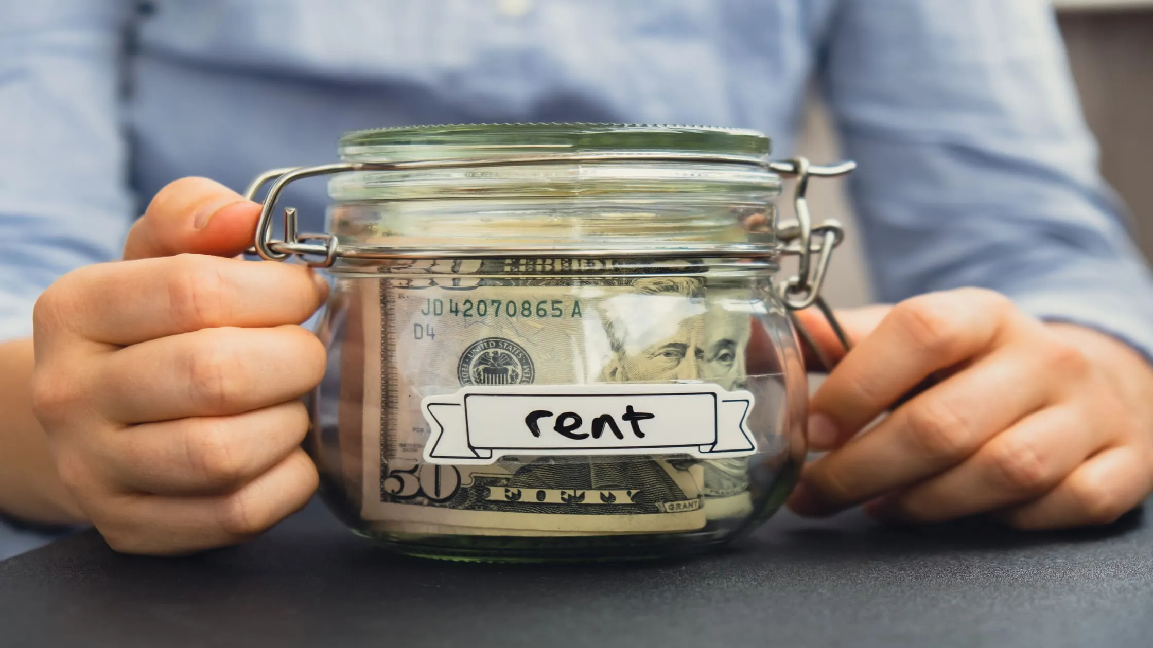 glass-savings-jar-with-cash-for-partial-rent-payment