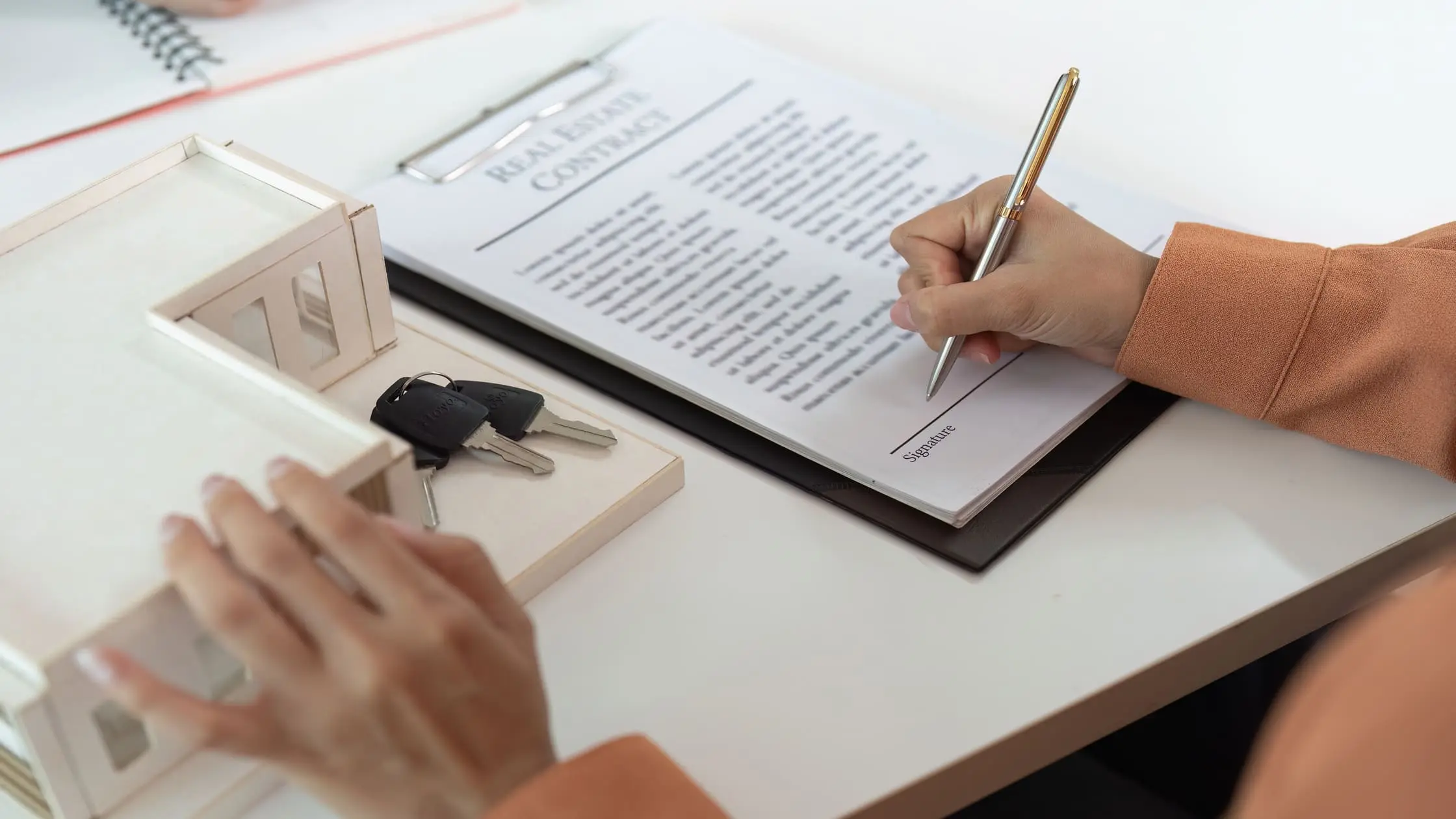 Lease buyout apartment agreement document on desk