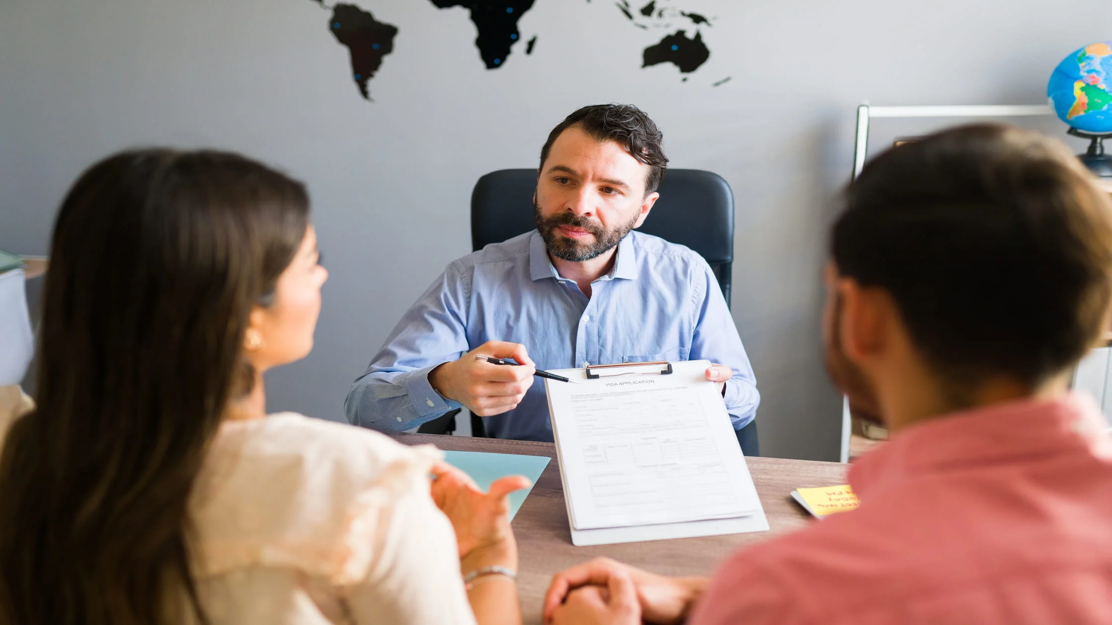 Landlord-weighing-documents-to-approve-or-deny-an-applicant-during-international-tenant-screening