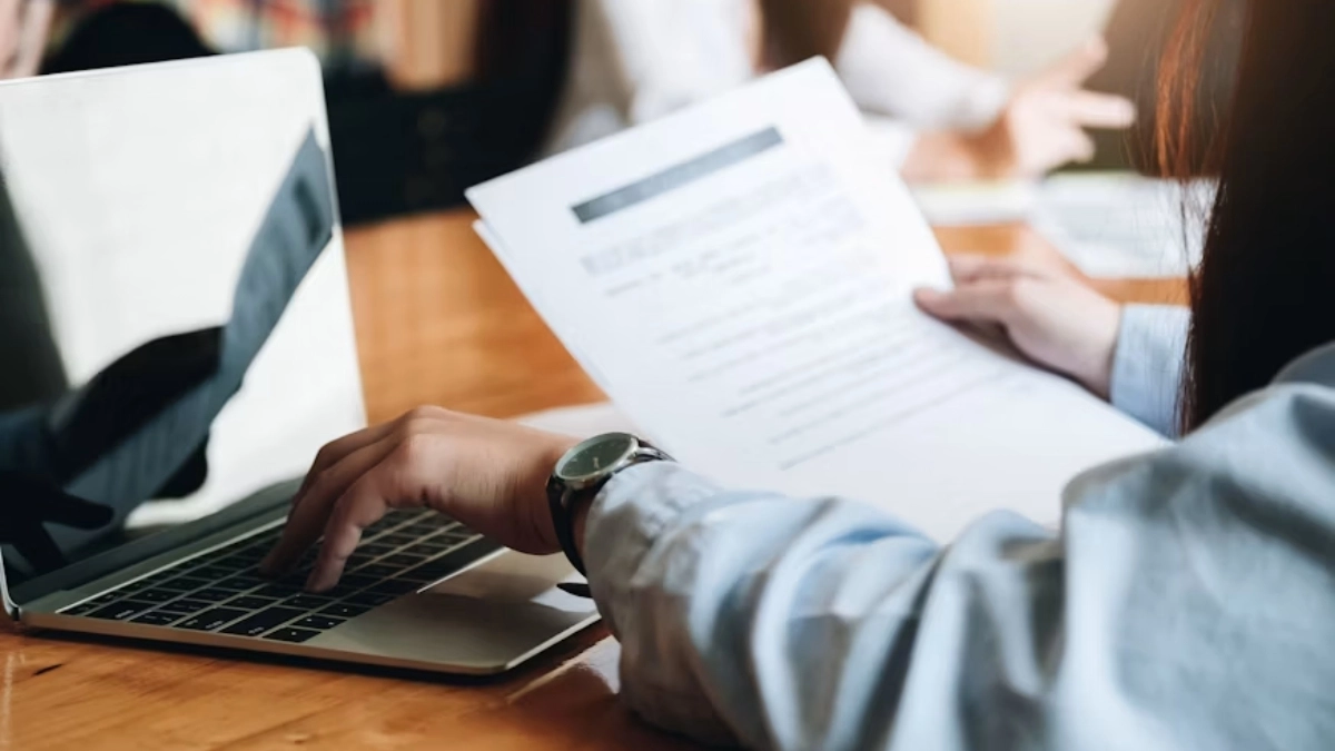 Rental applicant providing income documents during the screening process