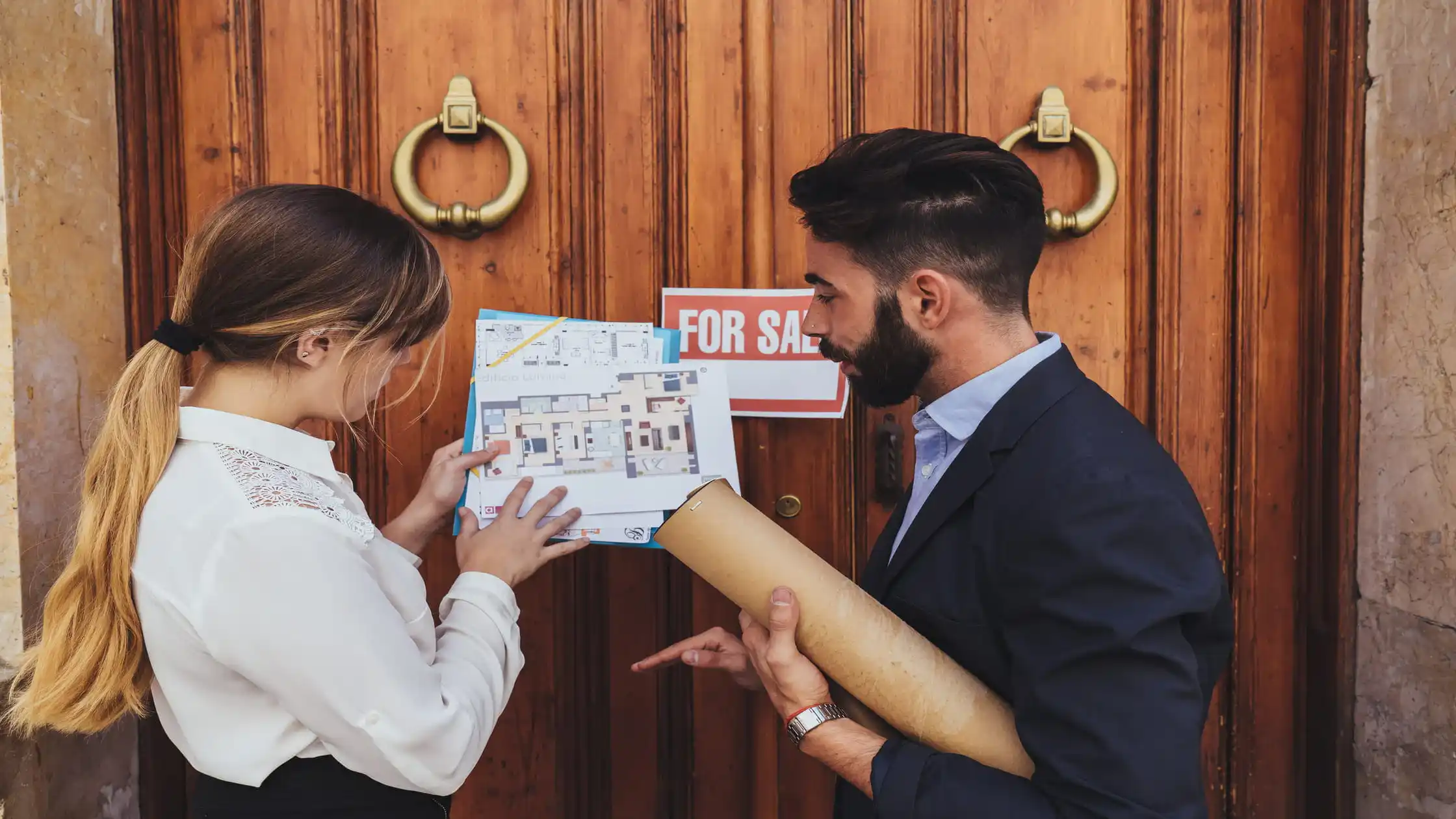 tenants-and-landlord-reviewing-property-flyer-to-find-private-landlords-offline