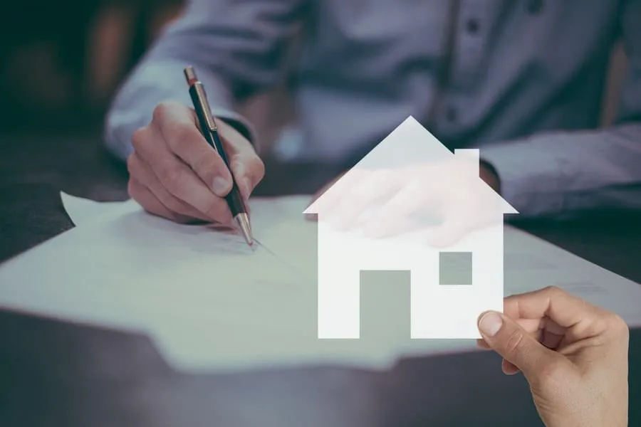 Landlord signing lease agreement for rental property