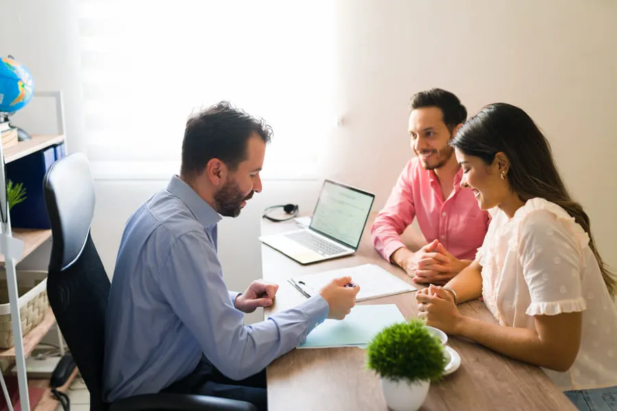  landlord-reviewing-a-rental-application-with-two-applicants-and-applying-tenant-screening-laws-consistently