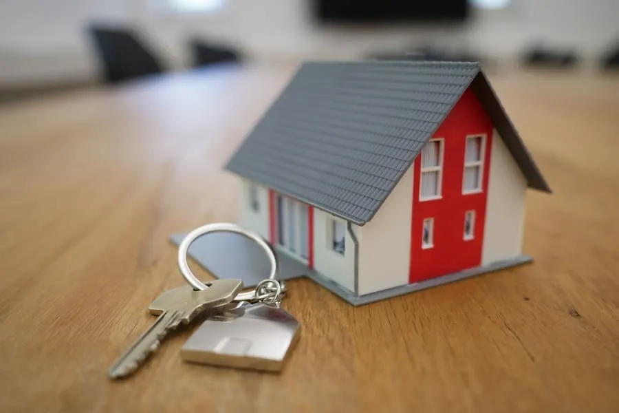 Rental property model with keys ready for tenants