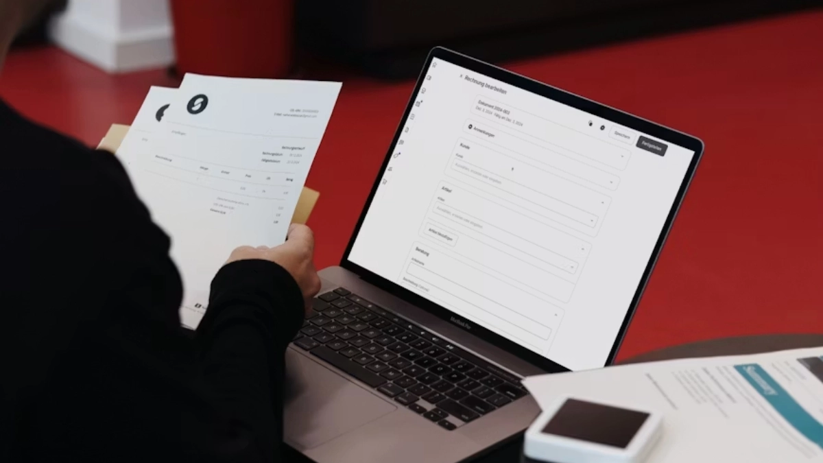 Landlord checking a portable tenant screening report for authenticity and required information